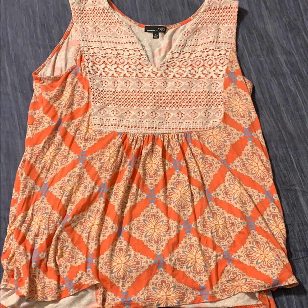 Orange and cream colored top with lace detail
